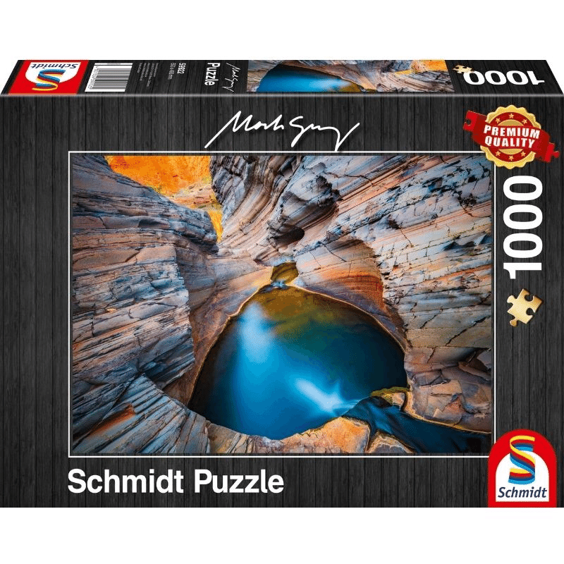Adult puzzle in indigo color by Schmidt, featuring interlocking pieces with intricate details and vibrant shades of blue.