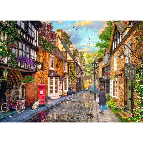 Ravensburger adult puzzle featuring Meadow Hill Lane scene with charming houses and lush greenery, assembled on a wooden table.