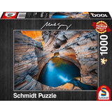 Adult puzzle in indigo color by Schmidt, featuring interlocking pieces with intricate details and vibrant shades of blue.