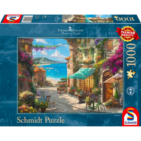 Thomas Kinkade café on the Italian Riviera adult puzzle by Schmidt featuring a scenic seaside café painting.